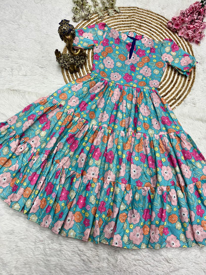 Floral dress with teddy bear pattern on a white surface