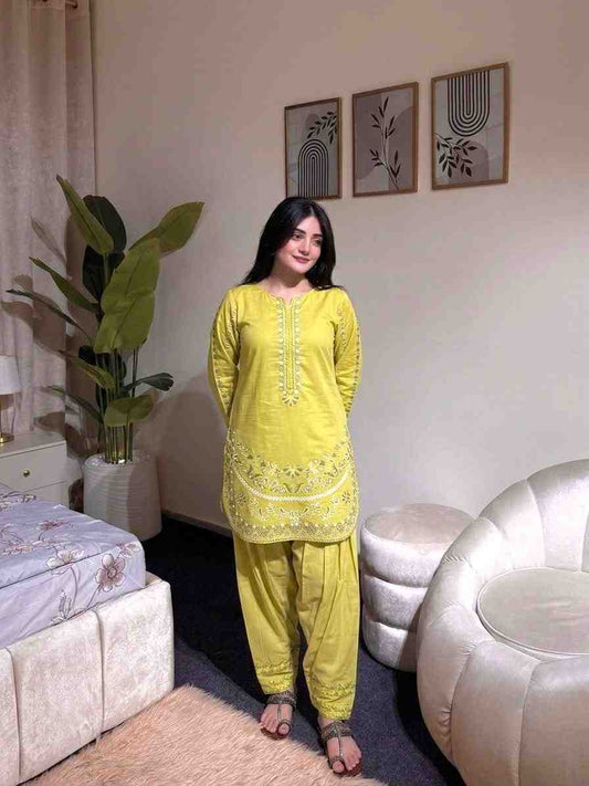 “Traditional yellow kurti with detailed embroidery paired with rayon palazzo”