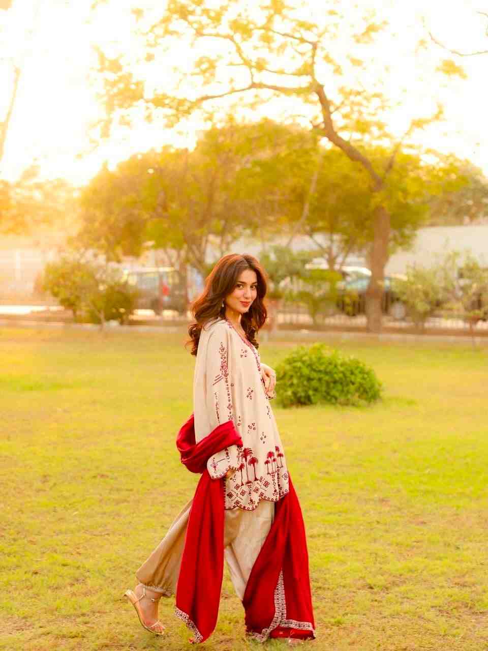 Elegant traditional kurti set with red dupatta outdoor shoot