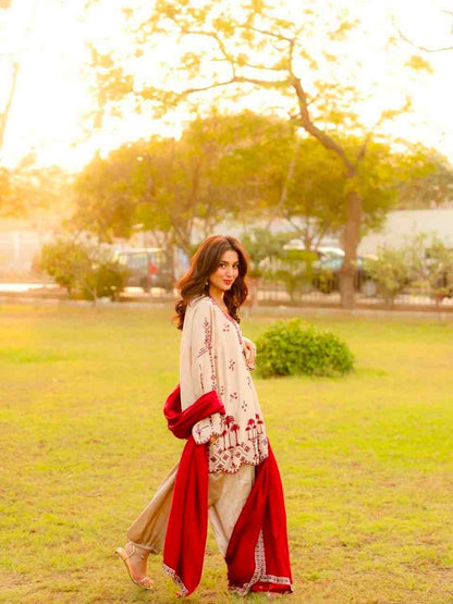 Elegant traditional kurti set with red dupatta outdoor shoot
