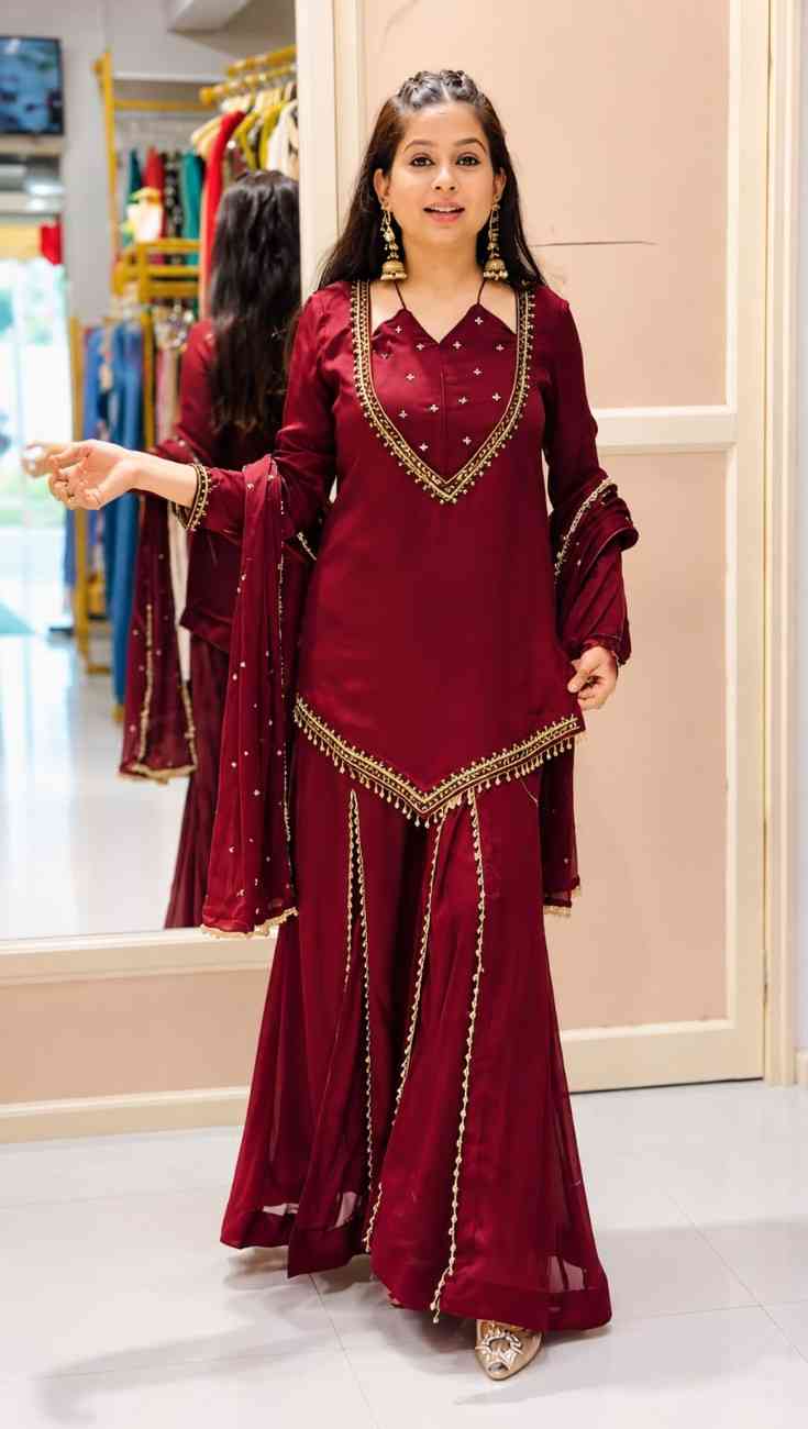 Woman wearing maroon mirror work kurti palazzo set with dupatta