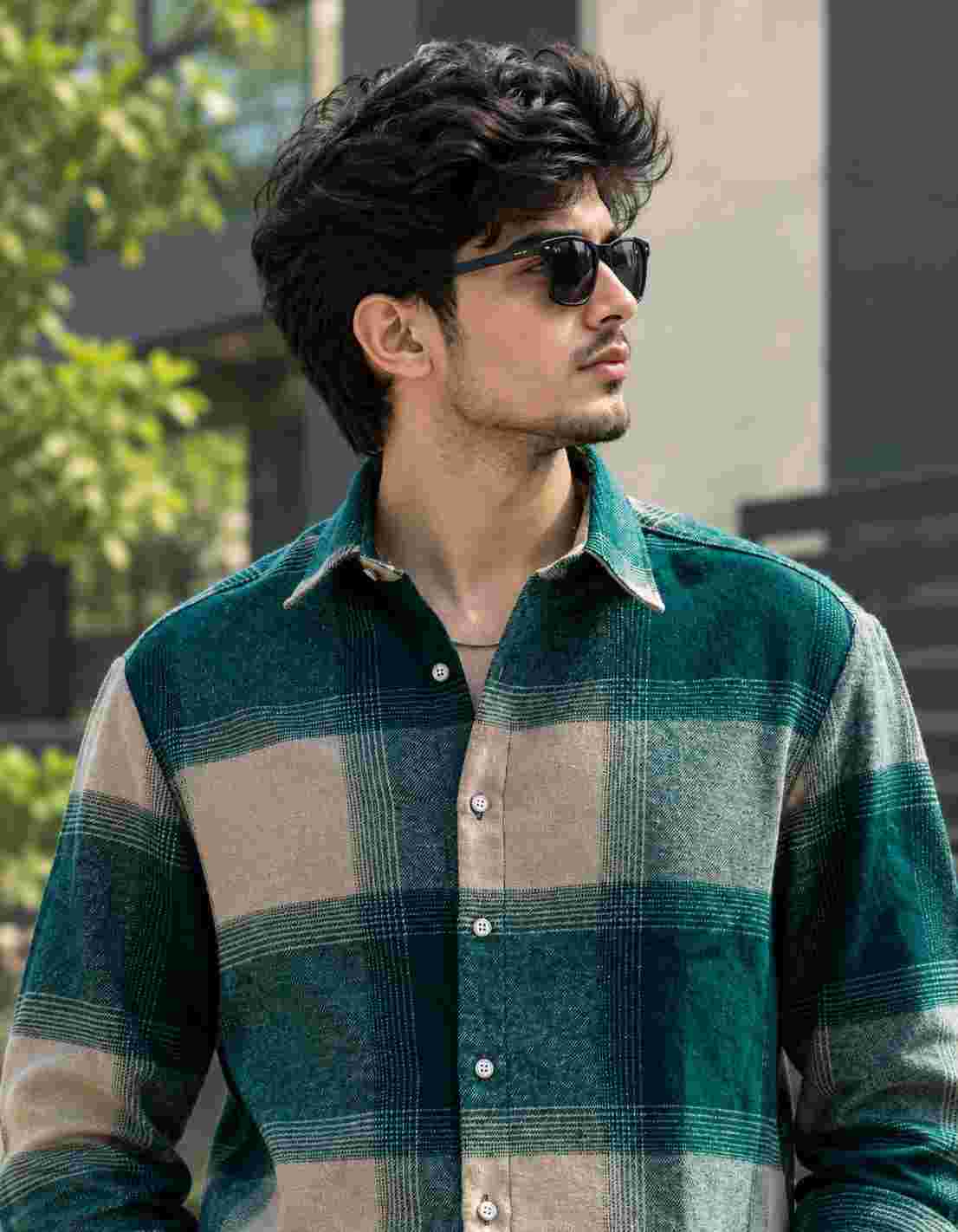 Close-up shot wearing boxy fit checked jute cotton shirt.   