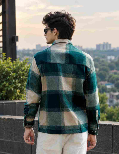 Back view wearing a men's boxy fit checked jute cotton shirt.