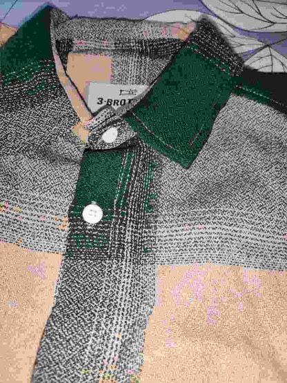 Close-up texture shot of jute cotton boxy shirt collar and placket detail.