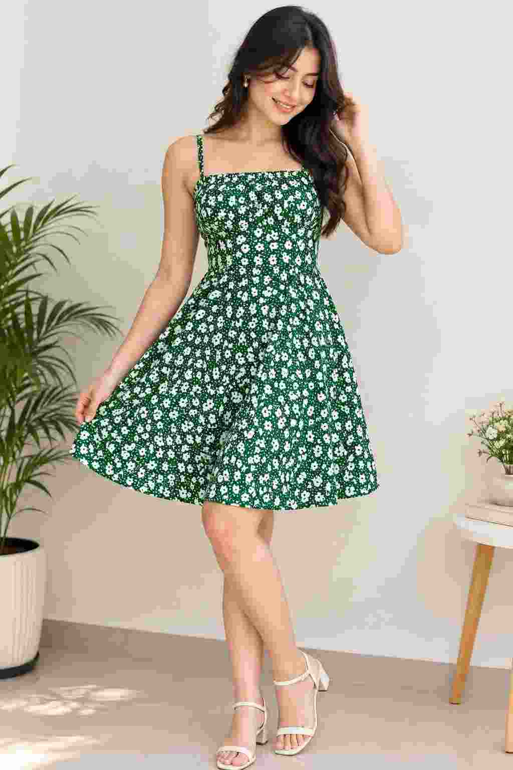 Sleeveless A-line floral dress with noodle straps.