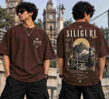 Front and back view wearing a brown 100% combed cotton oversized tee with Siliguri architectural DTF graphic print.