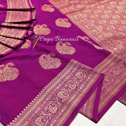 Purple saree with gold patterns and 'Crepe Banarasi' branding.
