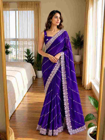 Fancy Rangoli silk saree with decorative pallu and blouse design